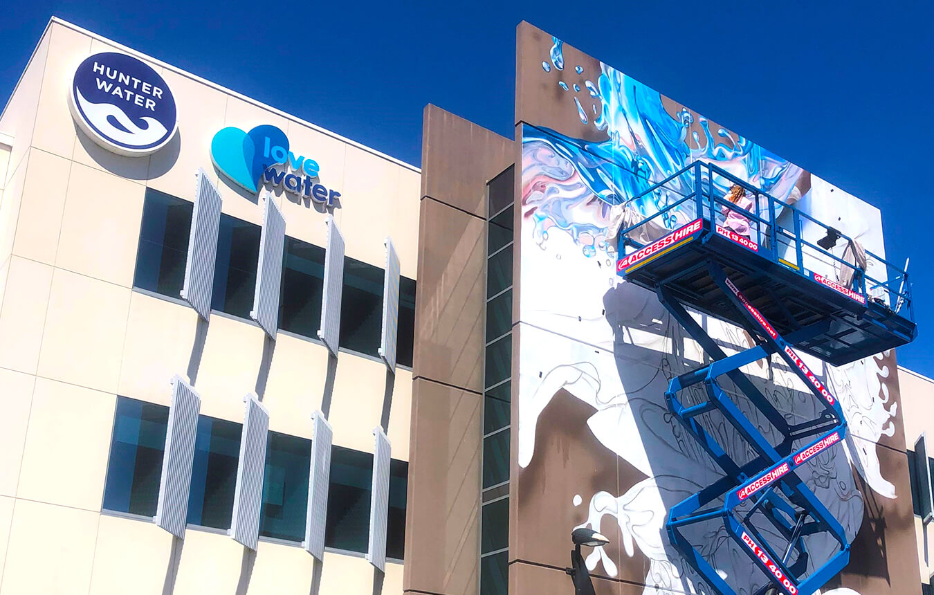 Rosie Woods' mural on Hunter Water building in Newcastle